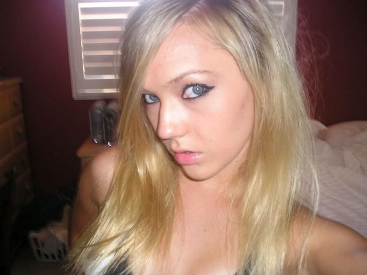 Gorgeous blonde teen with small tits posing on camera naked