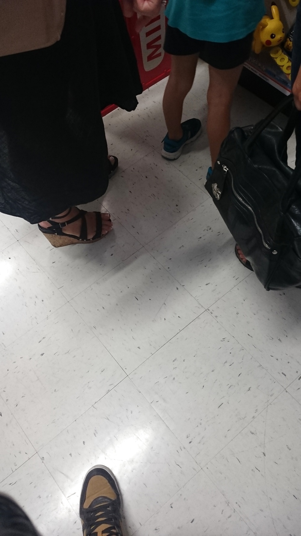 Candid heels feet and legs in supermarket 2