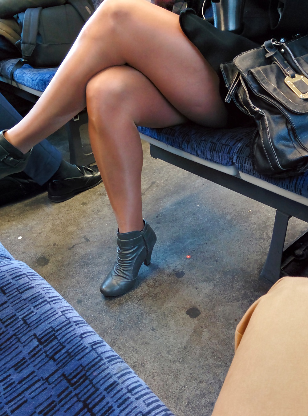 Short skirt slut on the train showing off