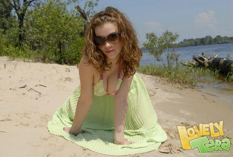Teen girl stripping on the beach