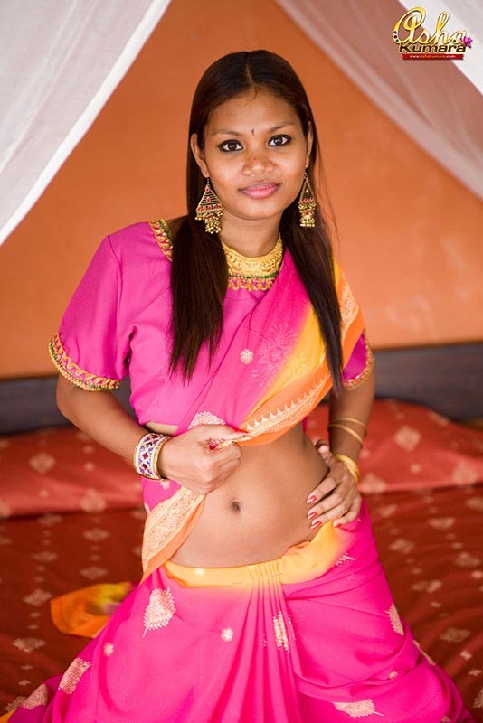 Exotic teen Asha covers her brown India titties with a sari