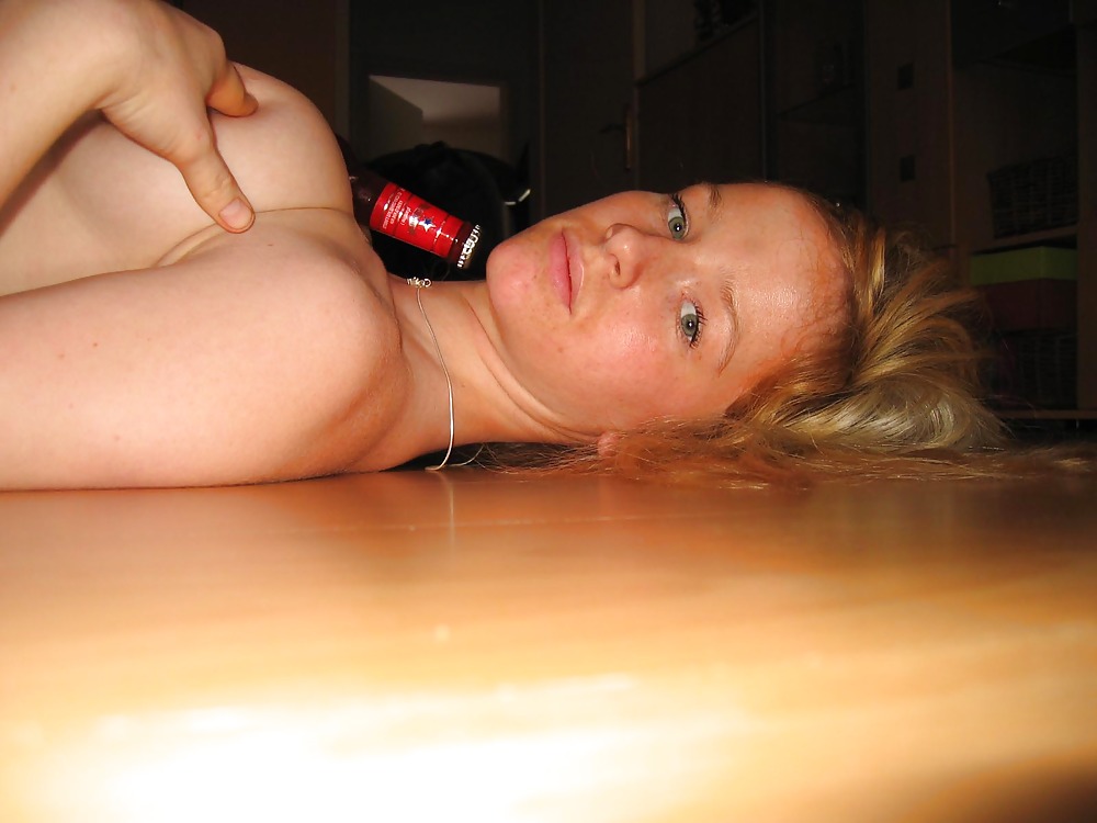 Blonde playing with a bottle - N. C.