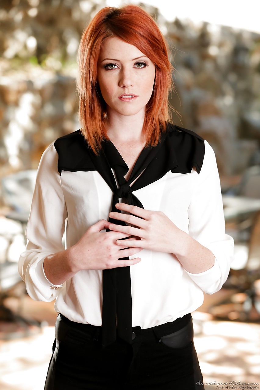 Gorgeous redhead stunner Elle Alexandra strips down sensually