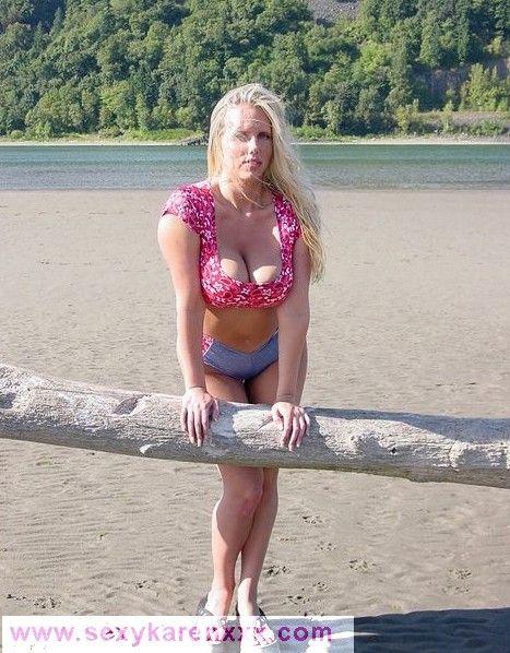 Pictures of Sexy Karen showing her boobs on a beach