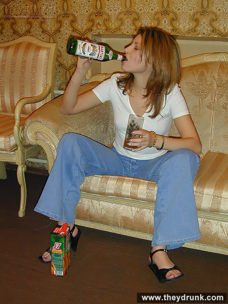 Drunk teen blonde Jennifer drinks wine from the bottle and goes