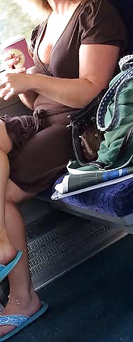Candid milf flashing tits and legs on train