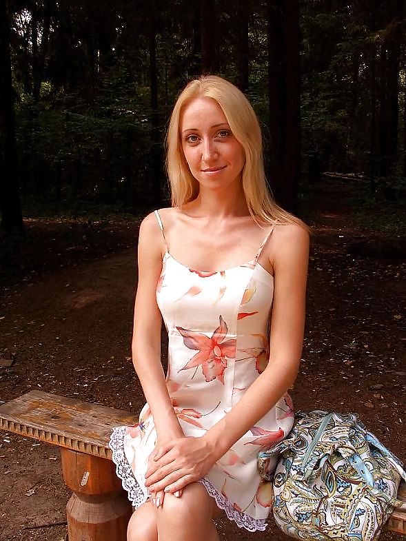 Blonde girl posing in the forest - N. C.