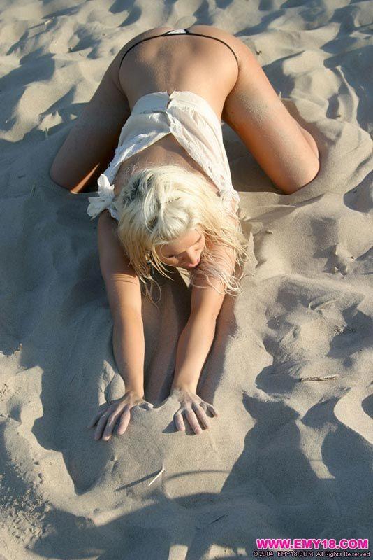 Pictures of teen Emy 18 teasing on a beach