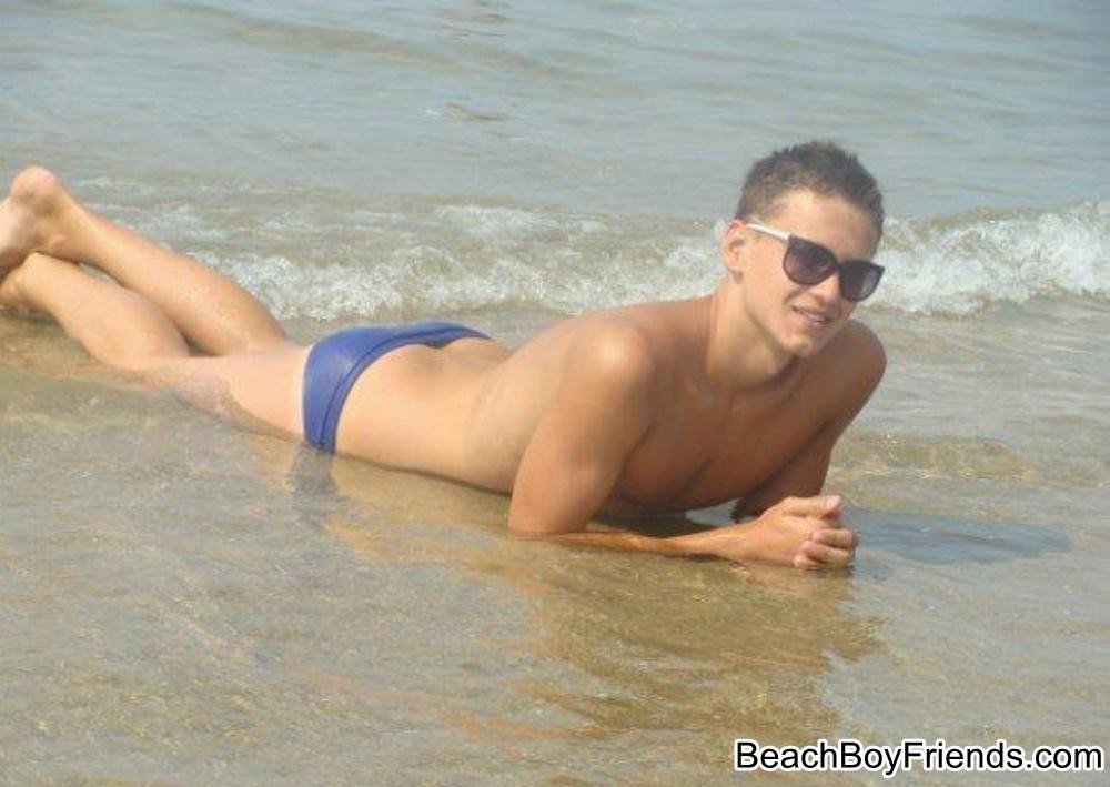 Hunk boys with big muscles posing topless at the beach
