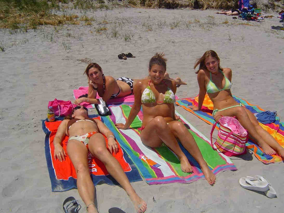 Teens topless on the beach