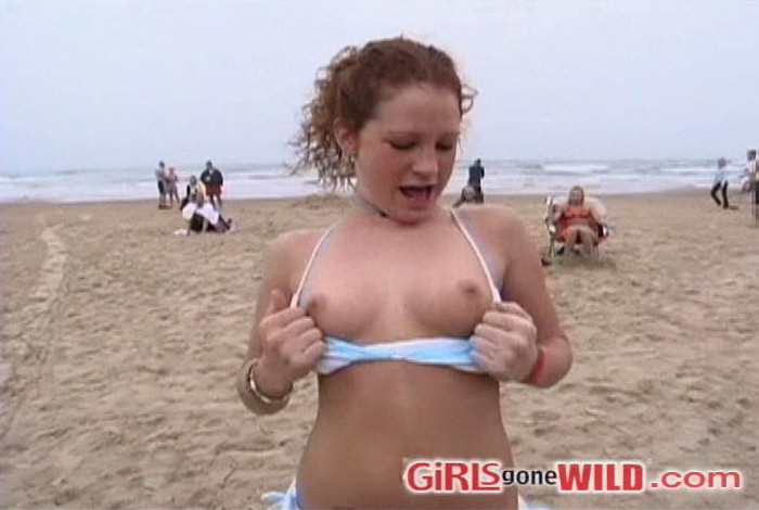 Young beach babe shows us her juggs