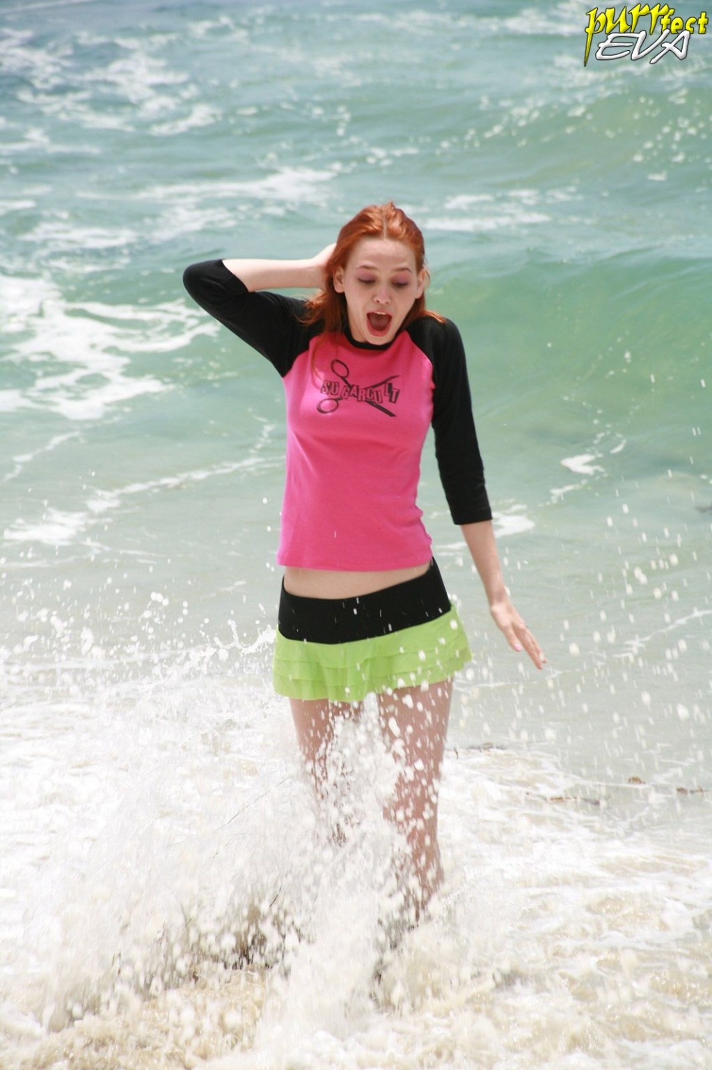 Redhead teen playing at the beach