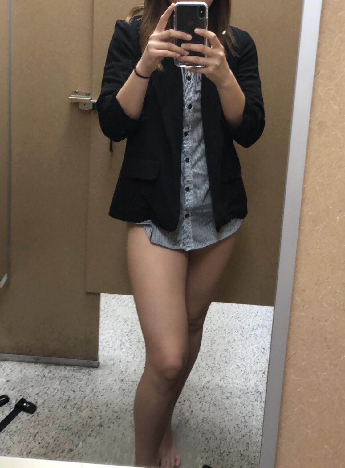 trying on clothes (f)or a job interview