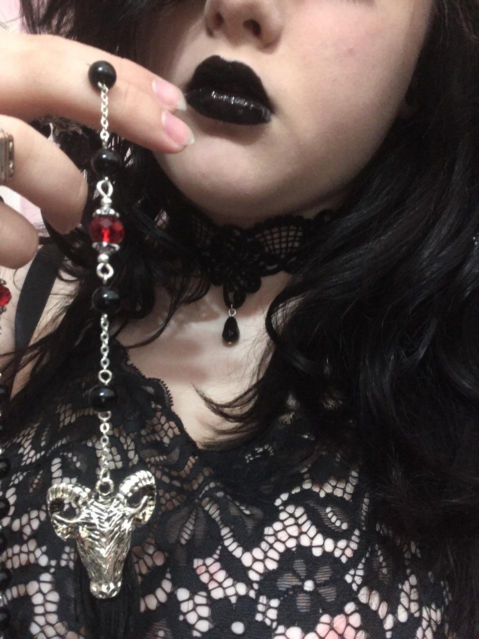 Lips like leather, satanic rosary, 80s goth music playing...