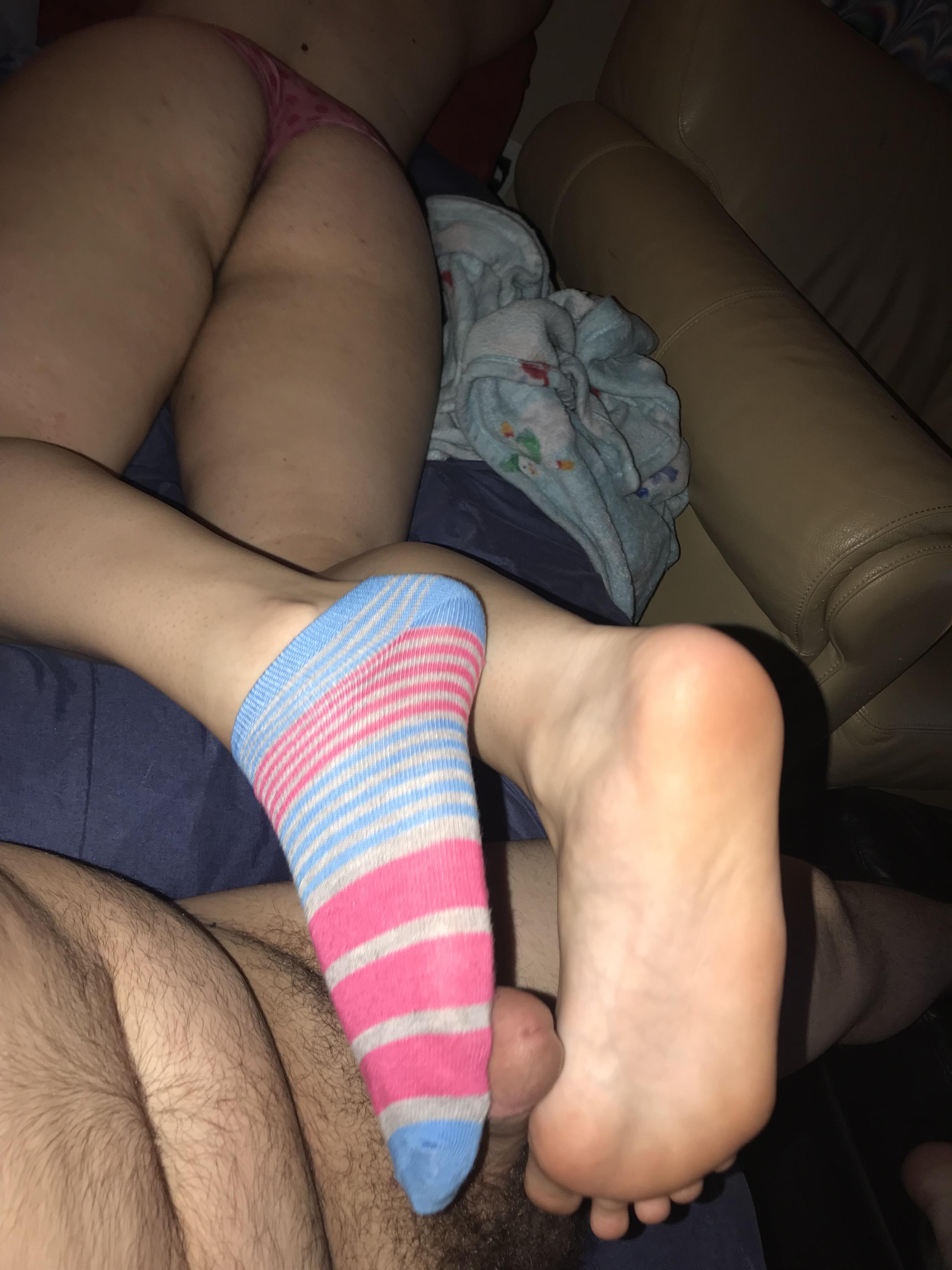 Teasing her daddy with her pillowey feet