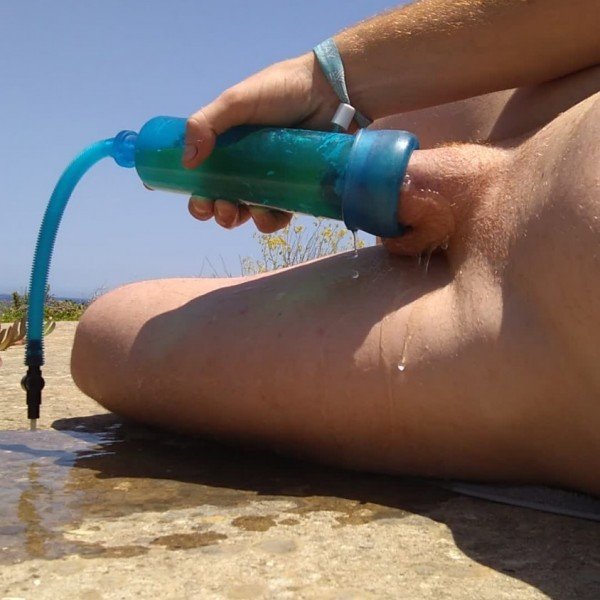 Swollen pumped up ginger dick destroys penis pump with his hot piss all over his muscular body