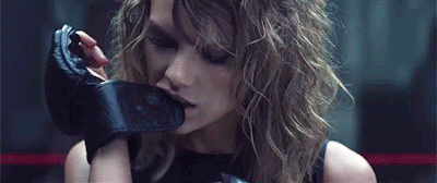 carriosity: current sexuality: taylor swift pulling on a glove by her