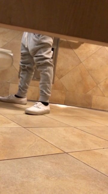 Dude showing off in bathroom.