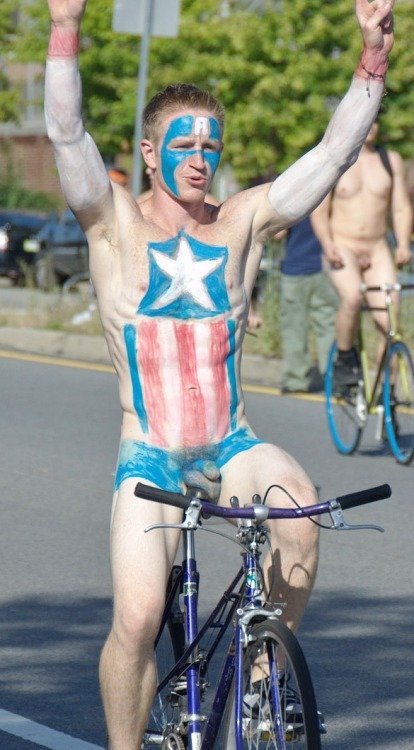 Naked cyclist body painted with Captain America
