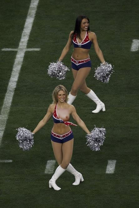 Cheerleader wardrobe malfunction photographed at a football game