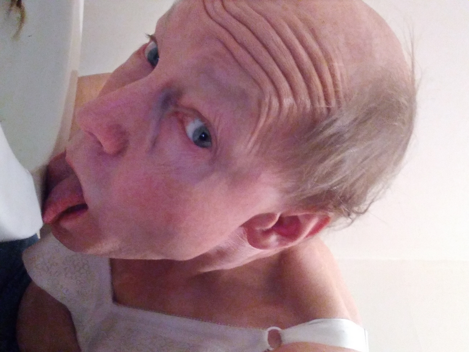 Ordered through Blackmail Bob Sodergren licks a toilet ring while wearing its Playtex Bra