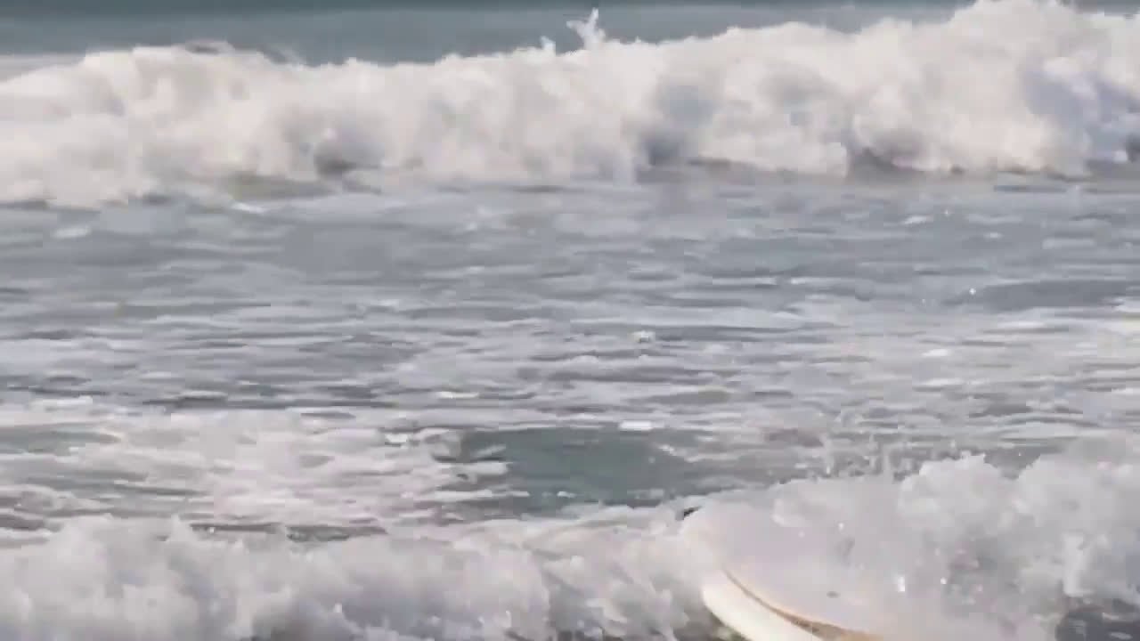 Surfer boob exposed